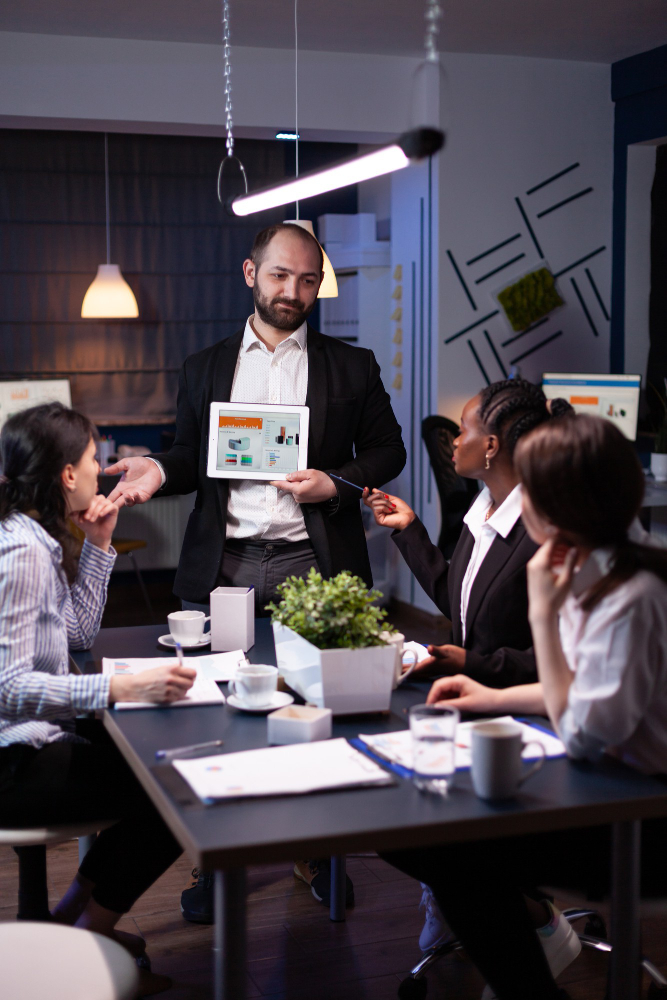 business-entrepreneur-man-presenting-company-statistics-using-tablet-financial-presentation